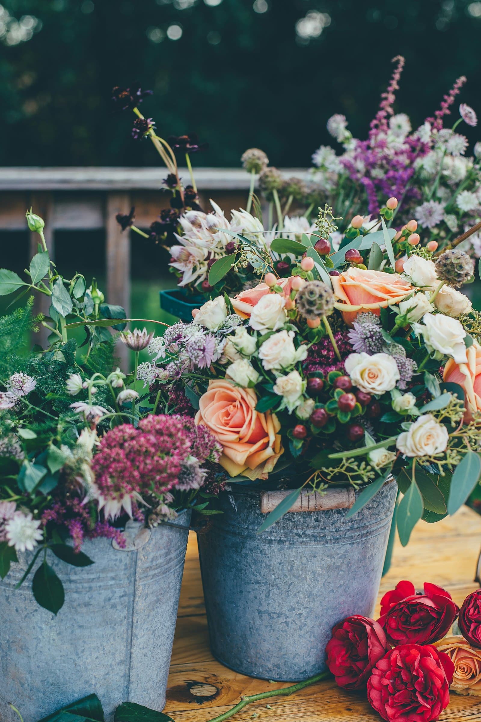 Fresh stems in metal buckets at the studio